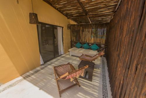 an overhead view of a room with a bed and chairs at Hotel Luna De Plata in Mahahual