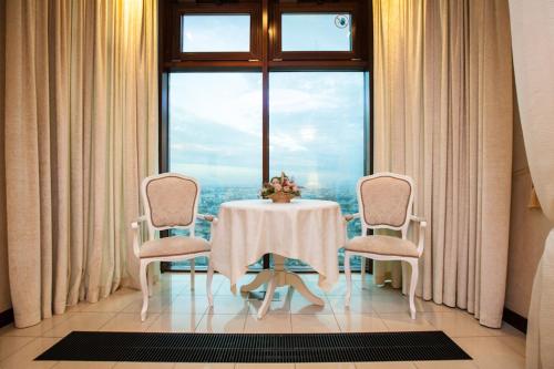 A seating area at Triumph Palace Boutique Hotel