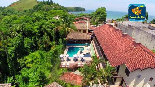an aerial view of a house with a swimming pool at Hotel Canto do Rio Maresias in Maresias