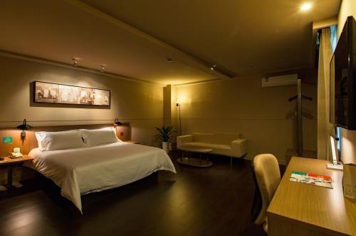 Postelja oz. postelje v sobi nastanitve Jinjiang Inn Select Shaoxing Jiefang North Road
