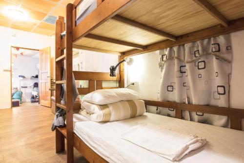 Voodi või voodid majutusasutuse On My Way Jiufen Youth Hostel toas