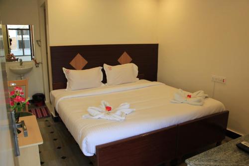 Sri Sarvesha Residency Temple viewにあるベッド