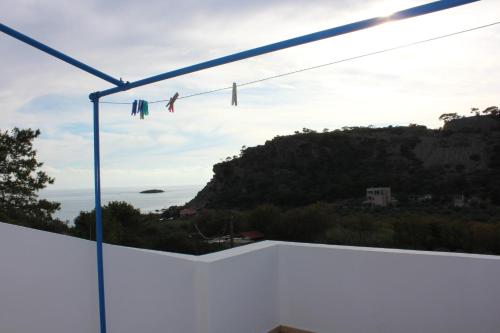 a view of the ocean from the balcony of a house at Aaron Studios Apartments in Agia Fotia