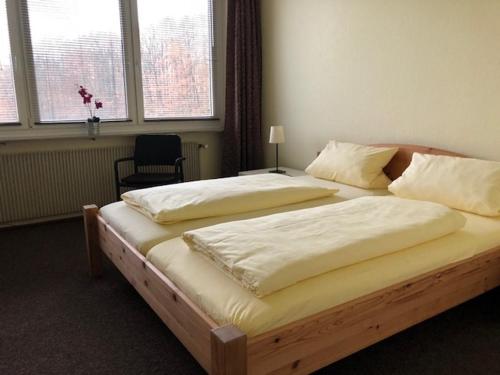 Кровать или кровати в номере Hotel am Siebenpfennigsknapp