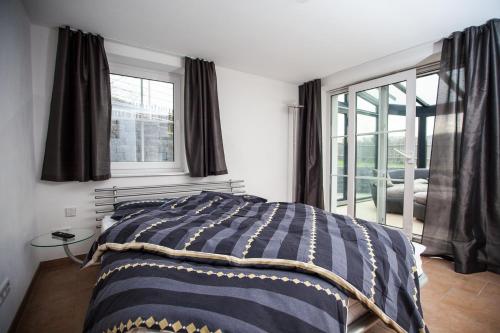 a bedroom with a bed and a window at Weinberghaus Prossen in Bad Schandau