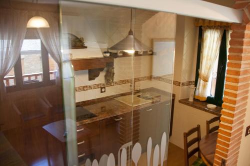 Kuchyň nebo kuchyňský kout v ubytování Hostal El Recanto