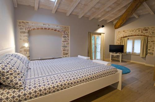 Ένα ή περισσότερα κρεβάτια σε δωμάτιο στο La Piana