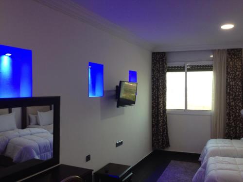 Ein Bett oder Betten in einem Zimmer der Unterkunft Hotel Salime Al Khozama