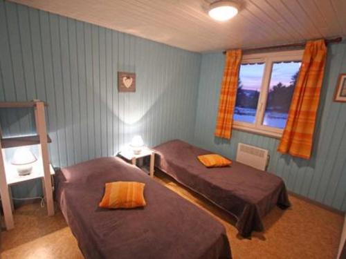 Llit o llits en una habitació de La Bresse Hautes Vosges Chalet le Paiquis