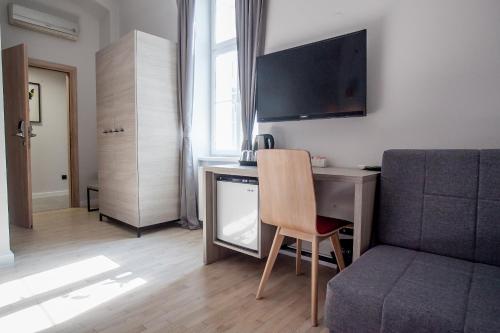 En TV eller et underholdningssystem på Zagreb City Vibe Apartments & Rooms