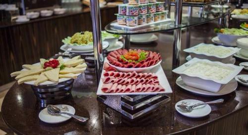 a buffet with many different types of food on a table at Dreamland oasis in Chakvi in Chakvi