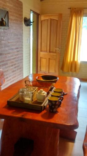a wooden table with a tray of dishes on it at Alpamayo in Nono