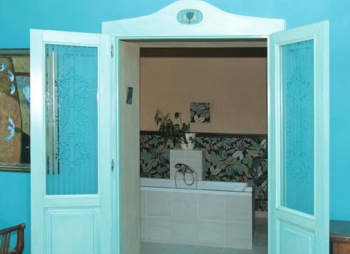 a bathroom with a tub and a sink at Penzion Haberský vrch in Habří