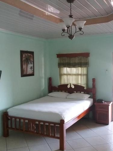 a bedroom with a large bed in a room at Islanders Place in Golden Grove