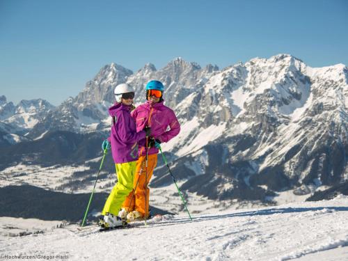 two people standing on top of a snow covered mountain at Ridehouse in Schladming