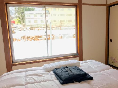 Ένα ή περισσότερα κρεβάτια σε δωμάτιο στο Hai Lodge