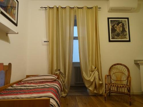 Postel nebo postele na pokoji v ubytování Rocchi Residence