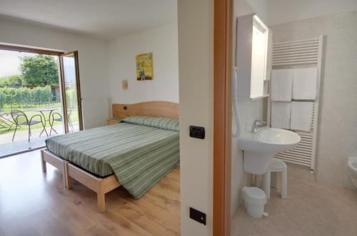 Postel nebo postele na pokoji v ubytování Agritur Comai
