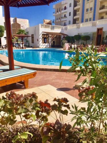 a swimming pool in the middle of a building at Zak Inn in Hurghada