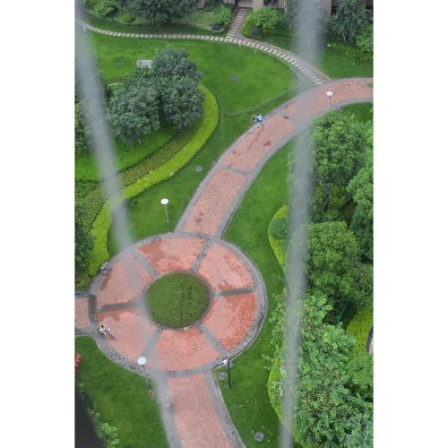 an aerial view of a park with a circular road at Lan House Youth Apartment in Guangzhou