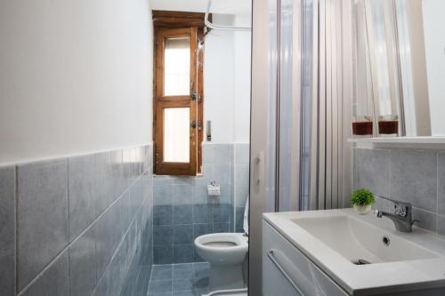 a bathroom with a toilet and a sink at B&B Terre di Mare in Salerno