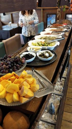 a long table with many plates of food on it at Taichung Xinshe Garden Life Homestay B&B in Xinshe
