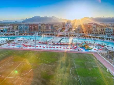 a large soccer field in a city with buildings at Chalets in Porto Sharm - Families Only AN in Sharm El Sheikh