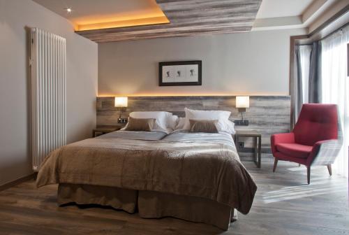 Postel nebo postele na pokoji v ubytování Hotel Boutique La Neu