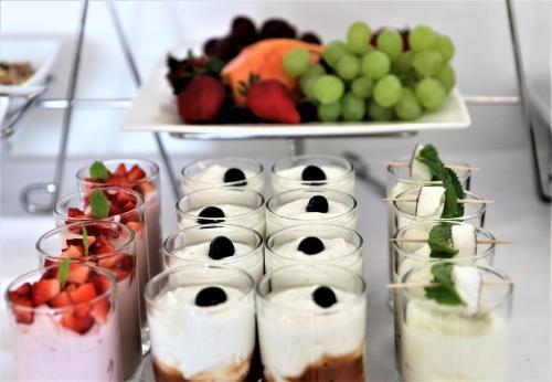a shelf of fruits and vegetables in glass containers at DysArt Boutique Hotel - Solar Power in Cape Town