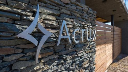 a stone wall with a sign on a building at Casas Acrux in Nono