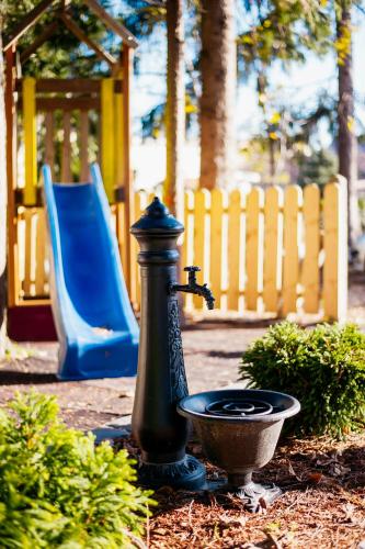 a water fountain in front of a playground at Sundial Boutique Hotel in Zagreb