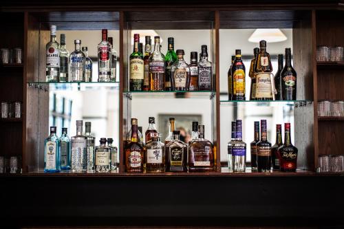a bar filled with lots of bottles of alcohol at Peppers Manor House in Sutton Forest
