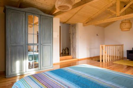 a bedroom with a large bed in a room at Casa de ferias em Caminha - Minho - in Caminha