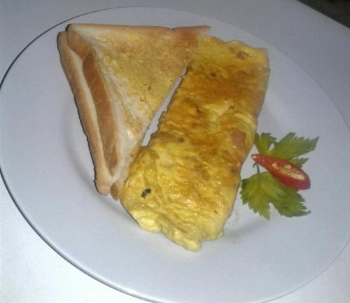 two pieces of food on a white plate at Gubug Balian Beach Bungalow in Selemadeg
