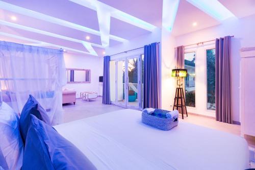 Ένα ή περισσότερα κρεβάτια σε δωμάτιο στο Cocotoa Boutique Hotel & Villa
