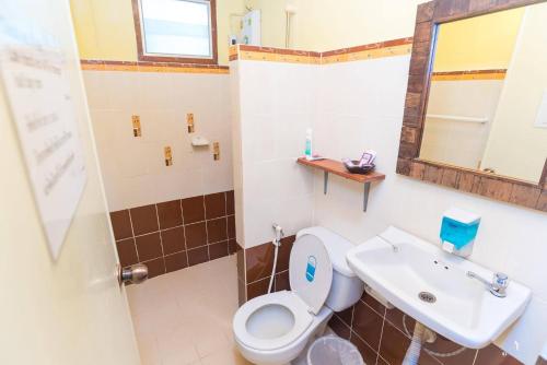 a bathroom with a toilet and a sink at The Countryside Pai in Pai