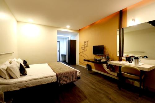 Телевизор и/или развлекательный центр в Hotel AGC