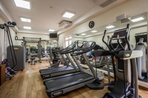 a gym with treadmills and elliptical machines at Sands Suites Resort & Spa in Flic-en-Flac