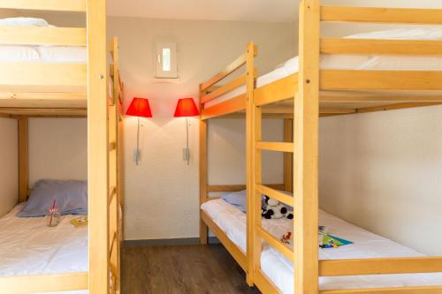 Кровать или кровати в номере Résidence Pierre & Vacances Le Fort de la Rade