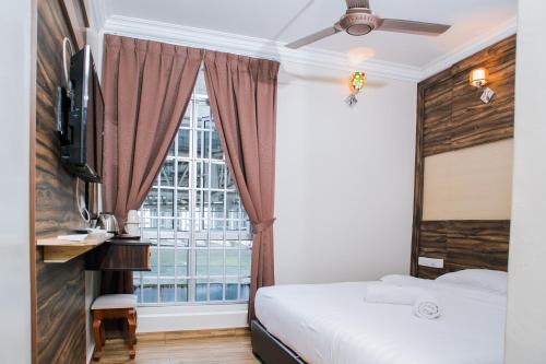 Кровать или кровати в номере Wan Alyasa Hotel
