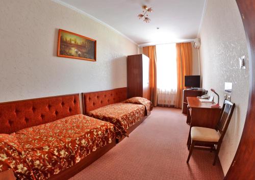 Cama o camas de una habitación en Afina Hotel