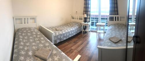 Ένα ή περισσότερα κρεβάτια σε δωμάτιο στο Route 7 Rooms