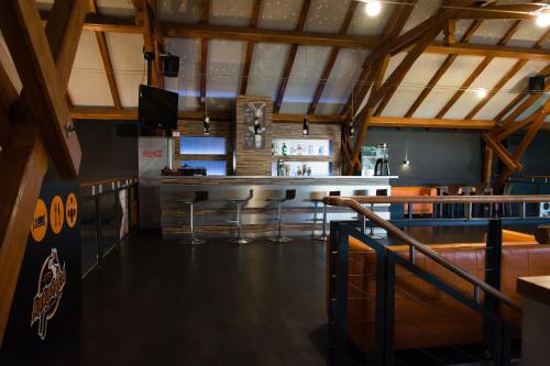 a bar in a building with a bar counter at Kukubara Bowling Center in Myszków
