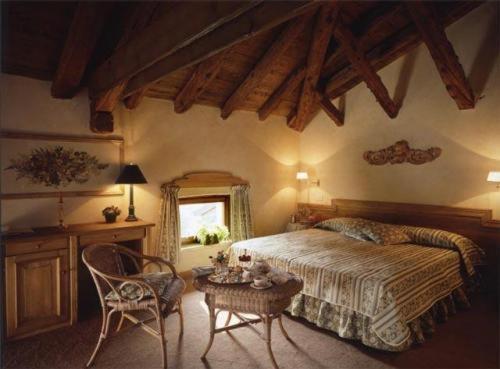 Кровать или кровати в номере Hotel L'Ultimo Mulino