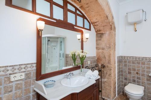 a bathroom with a sink and a mirror at Son Caldés in Llucmajor