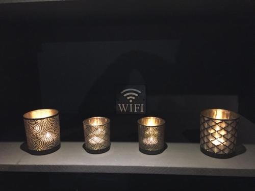 a group of gold candles sitting on a shelf at Gîte de Corbion Loft1 in Ciney