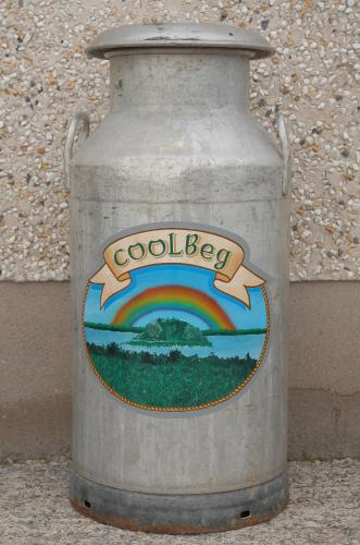 a metal can with a rainbow painted on it at Coolbeg Farmhouse in Maguires Bridge