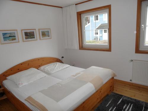 Кровать или кровати в номере ökologische Ferienanlage