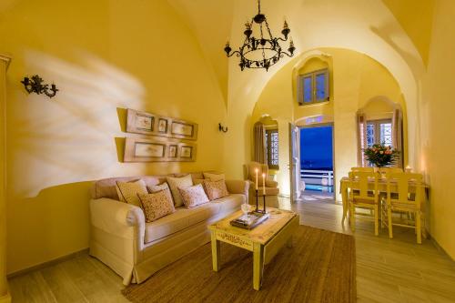 a living room with a couch and a table at Senses Suites in Imerovigli
