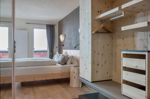 Postel nebo postele na pokoji v ubytování Hotel Garni Pirchhütt